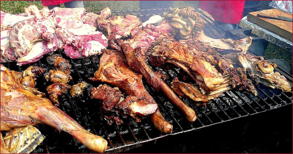 File image of meat pieces on roasting grill.